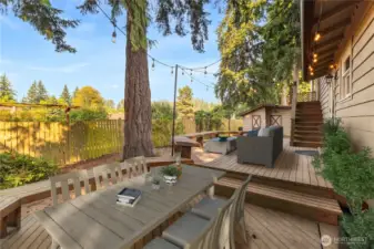 Built in benches on the deck can                 accommodate all your guests for the backyard BBQ!