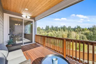 Main level deck with a sliding door that leads to the dining room.