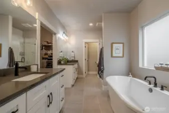 This bathroom is a retreat! Double sinks with great storage, soaking tub, tiled shower, water closet.