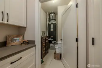Additional storage in this closet. Door to the right goes out to garage