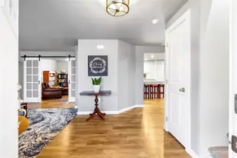 Greet guests at the front entry area.