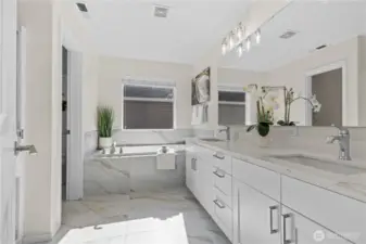 Updated 5-piece primary bathroom with private water closet.