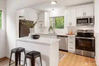 East Cottage - 22511 1/2: The new kitchen stands out with new stainless steel appliances.