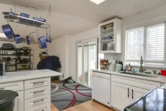 Part of the kitchen adjacent to the family room with a sliding glass door leading to the backyard