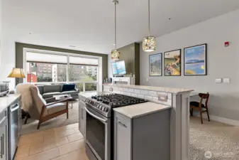 The kitchen flows effortlessly into a spacious living area.