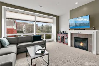 The heart of the living space is the beautiful gas fireplace with a custom mantle creating a warm and stylish focal point.