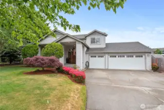 Welcome home. The property features a spacious driveway that can accommodate multiple vehicles.