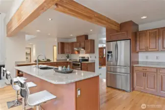 Spacious island accommodating up to five bar stools.