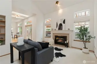 The family room windows offer a view of the well-maintained backyard.