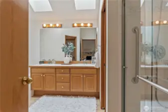 The primary bathroom features both a bathtub and a shower, as well as an additional walk-in closet.
