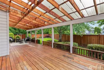 The covered deck extends nearly the entire length of the house.