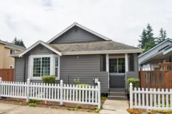 Picket fence giving you the charming neighborhood Vibe for this adorable one level easy maintenance rambler