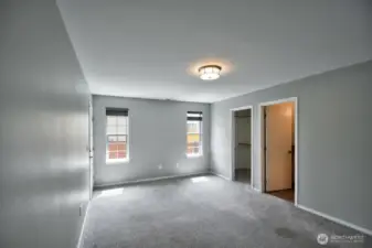 Primary Bedroom. Has a door to the side yard too.