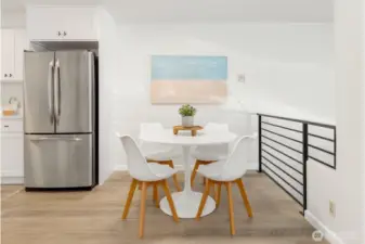 Charming dining nook with modern design, natural light, and convenient access to the kitchen.