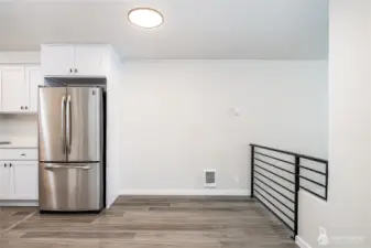Charming dining nook with modern design, natural light, and convenient access to the kitchen.