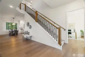 Enter into this Incredible Foyer, 10' Ceilings, Custom Staircase & Wood Floors Throughout ...