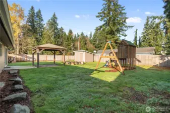 Excellent play structure, quaint firepit and generous shed in this private back yard.
