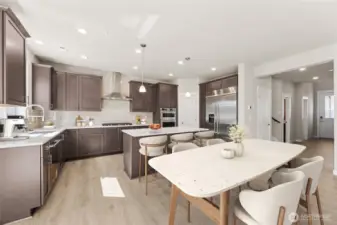 The Marigold has an excellent flow, with a wide 2 story entry - home for sale will include white cabinetry, this home is virtually staged.  Home includes gas cooktop & 30" built in refrigerator!