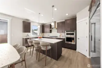 Home includes gas cooktop & 30" built in refrigerator - home for sale includes white cabinetry, virtually staged.