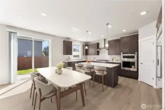 Home includes gas cooktop & 30" built in refrigerator - home for sale includes white cabinetry, virtually staged.  This is the same plan for sale on a different area within the community.