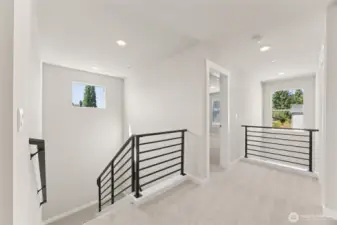Open and airy upstairs landing, with 2 story entry!