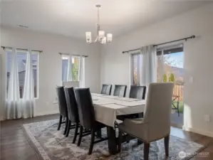 Large dining room featuring abundant natural light and ample space for gatherings.