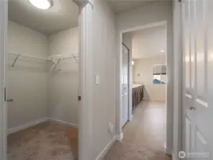 Ample storage with a walk-in closet and an additional closet conveniently located across from it.