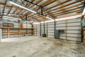 30D x 43W shop with open layout, high ceilings, and extensive shelving—ideal for projects, storage, or hobbies.