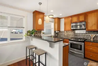 Well-planned open kitchen with breakfast bar.