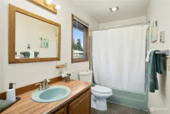 Jack and Jill bathroom connects bedroom with living space.