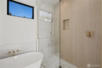Big dual head shower & soaking tub.