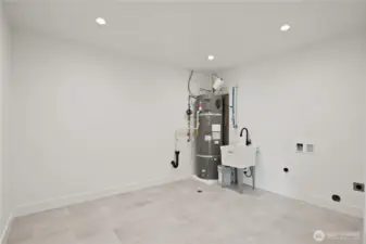 Big downstairs mechanical/laundry room w/sink & lots of storage room.