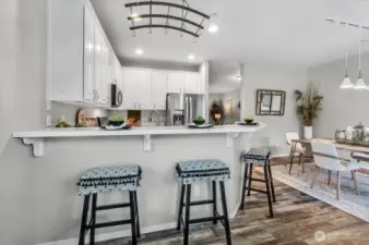 Are they helping more by sitting on the stools or washing the dishes?