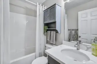 The hall bath has a nice deep tub.