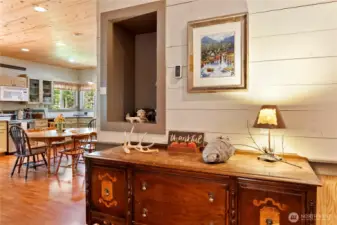 A lovely foyer with built-in cubby leads you to the kitchen and family room.
