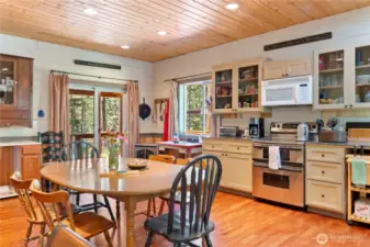 The kitchen is well-appointed with appliances, cupboards, and granite counters.