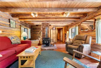 The living room is a favorite spot for reading or cozying up to the woodstove in winter.