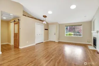 Living room with big window out to the front yard.