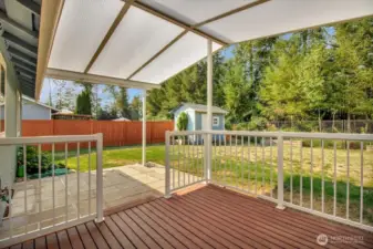 Amazing covered deck keeps the rain off but lets the light in!
