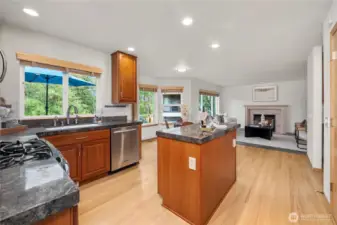 Granite countertops, stainless steel appliances, and hardwood flooring—this kitchen truly has it all.