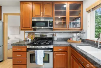 Equipped with a gas stove and ample storage, this kitchen is ready for your culinary adventures.