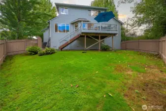 Professionally landscaped yard offering privacy and tranquility.