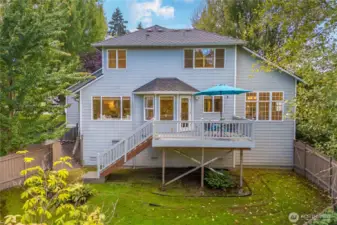 Relax on the private deck surrounded by established trees and greenery.