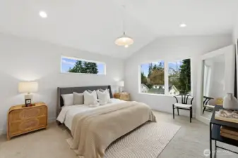 Spacious primary with tall ceilings, large windows, walk-in closet, and spa-like bathroom.