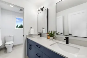 Dual sinks in the shared full bathroom.