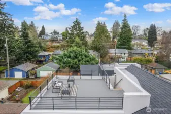 Spacious rooftop deck for summer fun.