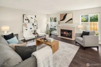 New LVP flooring throughout and cozy fireplace in oversized living room.