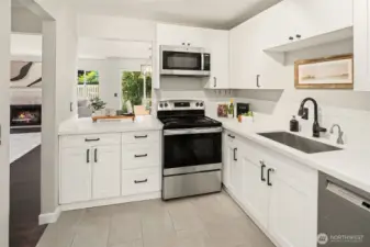 New kitchen cabinets, quartz counters, stainless steel appliances, and paint!