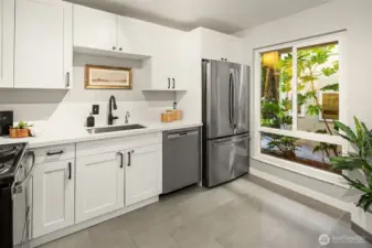 Ample space for rolling island and oversized window to bring in natural light!