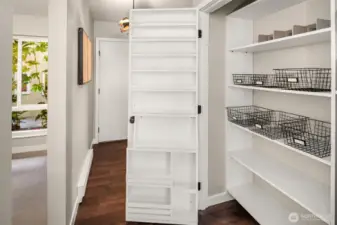 Large pantry with organization off kitchen.